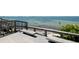 Relaxing waterfront view with benches and wooden railings at 875 Indian Beach Dr, Sarasota, FL 34234