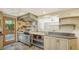 Kitchen with commercial stove and access to backyard at 875 Indian Beach Dr, Sarasota, FL 34234