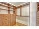 Large walk-in closet with ample shelving and drawers at 875 Indian Beach Dr, Sarasota, FL 34234