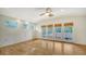 Large bedroom with hardwood floors and access to a balcony at 875 Indian Beach Dr, Sarasota, FL 34234