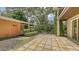 Outdoor patio area with flagstone flooring and landscaping at 875 Indian Beach Dr, Sarasota, FL 34234