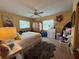 Bedroom with queen bed, armoire, and window seat at 1815 Restful Dr # N27, Bradenton, FL 34207