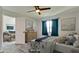 Main bedroom with dresser and view of sitting area at 2704 60Th Avenue S Plz # 2704, Bradenton, FL 34207