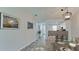 Virtually staged dining area with view to kitchen and entryway at 2704 60Th Avenue S Plz # 2704, Bradenton, FL 34207