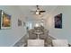 Virtually staged dining room with table and chairs, kitchen view at 2704 60Th Avenue S Plz # 2704, Bradenton, FL 34207