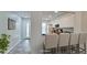 Modern kitchen with breakfast bar and white cabinets at 2704 60Th Avenue S Plz # 2704, Bradenton, FL 34207