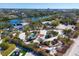 An aerial view of a house with landscaping with a circular driveway at 7665 Sanderling Rd, Sarasota, FL 34242