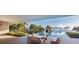 Breathtaking infinity pool overlooking the ocean, complemented by stylish outdoor seating and lush tropical surroundings at 7665 Sanderling Rd, Sarasota, FL 34242