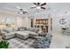 Open concept living room with sectional sofa and kitchen views at 7922 Tybee Ct, University Park, FL 34201