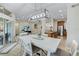 Bright dining area with white table, chairs, and kitchen access at 7922 Tybee Ct, University Park, FL 34201