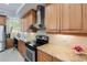 Kitchen features granite countertops, wood cabinets, and a stainless steel range at 7922 Tybee Ct, University Park, FL 34201