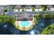 Community pool and sundeck situated on a tranquil lake at 7922 Tybee Ct, University Park, FL 34201