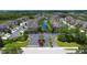 Aerial view of Savannah Reserve community, showcasing its lake and townhomes at 7922 Tybee Ct, University Park, FL 34201