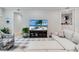 Bright living room featuring sectional sofa, large TV, and ample natural light at 7922 Tybee Ct, University Park, FL 34201