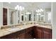 Double vanity bathroom with granite countertops at 7922 Tybee Ct, University Park, FL 34201