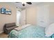 Bedroom with a full-size bed and a sofa at 7922 Tybee Ct, University Park, FL 34201