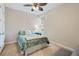 Bedroom with a full-size bed and ceiling fan at 7922 Tybee Ct, University Park, FL 34201