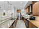 Modern kitchen with stainless steel appliances and granite countertops at 7922 Tybee Ct, University Park, FL 34201