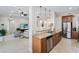 Open kitchen with granite countertops, stainless steel appliances, and island at 7922 Tybee Ct, University Park, FL 34201