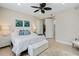 Bright bedroom with a queen-size bed and ensuite access at 7922 Tybee Ct, University Park, FL 34201