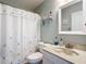 Clean bathroom with seashell-themed decor and a shower/tub combo at 2843 Abbotsford St, North Port, FL 34287