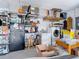 Laundry room with washer, dryer, and storage shelves at 2843 Abbotsford St, North Port, FL 34287