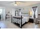 Spacious main bedroom with a metal bed frame and large mirror at 2843 Abbotsford St, North Port, FL 34287
