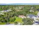Aerial view of a house with a spacious yard, located in a quiet residential neighborhood at 2843 Abbotsford St, North Port, FL 34287