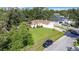 House with a large front yard and driveway, aerial view at 2843 Abbotsford St, North Port, FL 34287