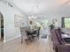 Bright dining room with wood floors and access to the patio at 2843 Abbotsford St, North Port, FL 34287