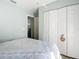 Bedroom with queen bed and large closet; view of kitchen at 2843 Abbotsford St, North Port, FL 34287