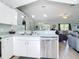 Open kitchen with stainless steel appliances and view to dining area at 2843 Abbotsford St, North Port, FL 34287