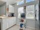 Charming kitchen with white cabinets and stainless steel appliances at 2843 Abbotsford St, North Port, FL 34287