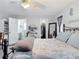 Main bedroom with a metal bed frame and access to bathroom and closet at 2843 Abbotsford St, North Port, FL 34287