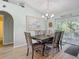Charming dining room with wood floors and patio access at 2843 Abbotsford St, North Port, FL 34287