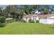 House exterior showcasing a well-maintained lawn and curb appeal at 2843 Abbotsford St, North Port, FL 34287