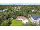 An aerial view showcasing a charming house with a well-maintained lawn at 2843 Abbotsford St, North Port, FL 34287
