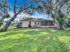 Spacious backyard with a large deck and screened patio at 2843 Abbotsford St, North Port, FL 34287