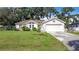 Cute one-story home with a large yard and attached garage at 2843 Abbotsford St, North Port, FL 34287