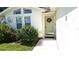 Inviting front entry with a light green door and wreath at 2843 Abbotsford St, North Port, FL 34287