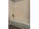 Bathroom with a bathtub and tiled walls at 4025 Crockers Lake Blvd # 11, Sarasota, FL 34238