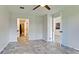 Well-lit bedroom featuring vinyl flooring and access to bathroom at 2704 60Th Avenue S Plz # 2704, Bradenton, FL 34207