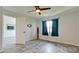 Spacious bedroom with ceiling fan and grey vinyl flooring at 2704 60Th Avenue S Plz # 2704, Bradenton, FL 34207