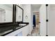 Updated bathroom with dark vanity and large mirror at 2704 60Th Avenue S Plz # 2704, Bradenton, FL 34207