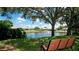 Serene pond with fountain, landscaping, and a bench at 2704 60Th Avenue S Plz # 2704, Bradenton, FL 34207