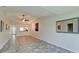 Open concept living area with vaulted ceiling and vinyl plank flooring at 2704 60Th Avenue S Plz # 2704, Bradenton, FL 34207
