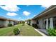 Community backyard with lush landscaping and patio access at 2704 60Th Avenue S Plz # 2704, Bradenton, FL 34207