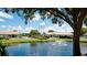 Community pond with fountain and surrounding greenery at 2704 60Th Avenue S Plz # 2704, Bradenton, FL 34207