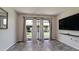Living room features vinyl flooring, sliding glass doors and backyard access at 2704 60Th Avenue S Plz # 2704, Bradenton, FL 34207