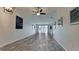 Bright living room with vinyl flooring, and sliding glass doors leading to the patio at 2704 60Th Avenue S Plz # 2704, Bradenton, FL 34207